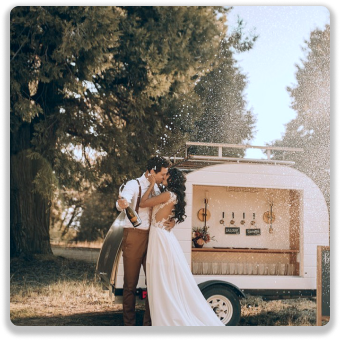 Couple celebrating with champagne at The Gather Rig